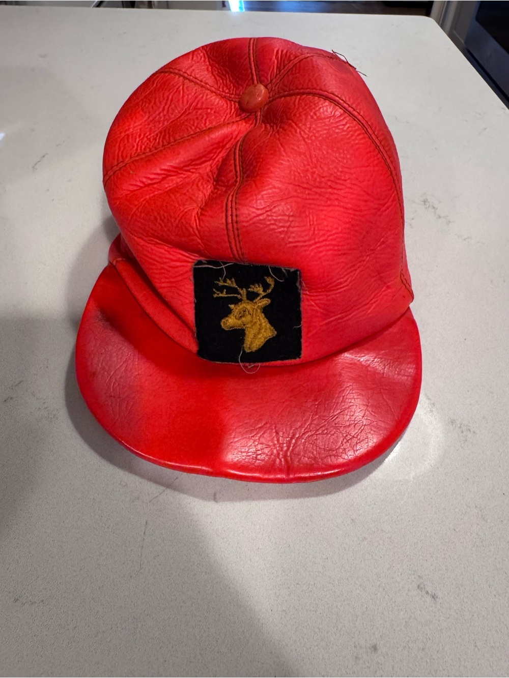 Orange Leather Cap with Embroidered Stag Patch - Men's Accessory